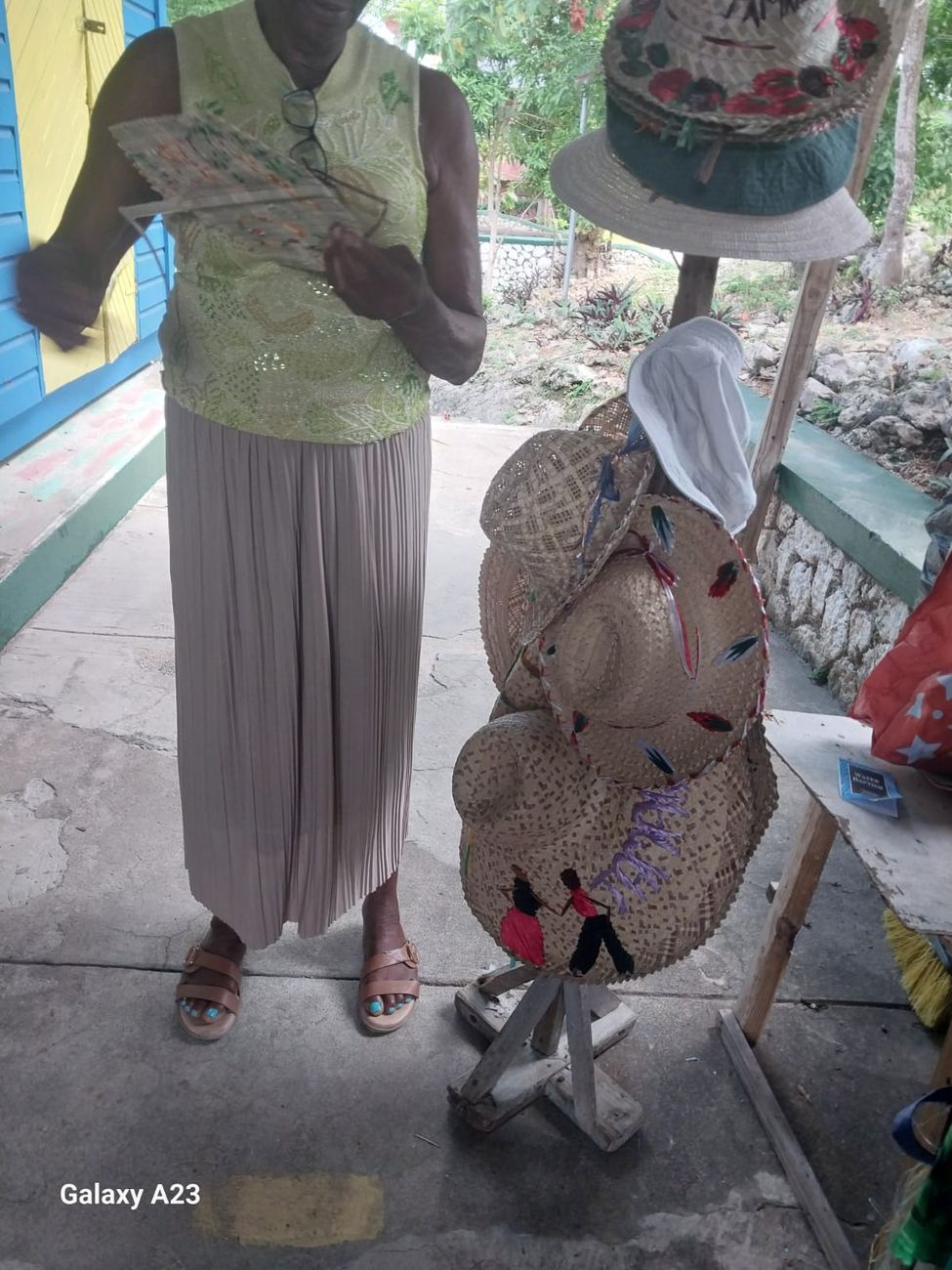 Hand-painted straw hats and woven baskets on display